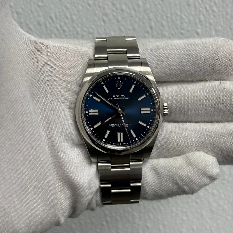 watches for women with large, modern faces and slim bands -Rolex Oyster Perpetual 41mm Blue Dial Ref# 124300